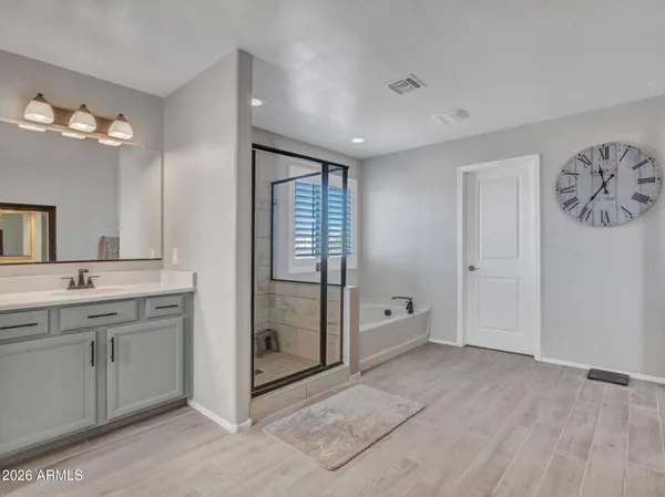 an aerial view of residential houses with outdoor space and city view
