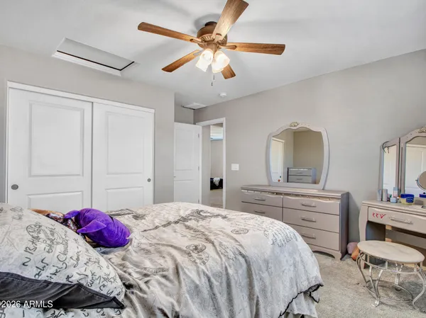 an aerial view of a house with swimming pool outdoor seating and mountain view