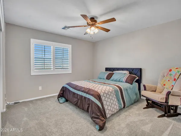 an aerial view of a house with a yard and lake view