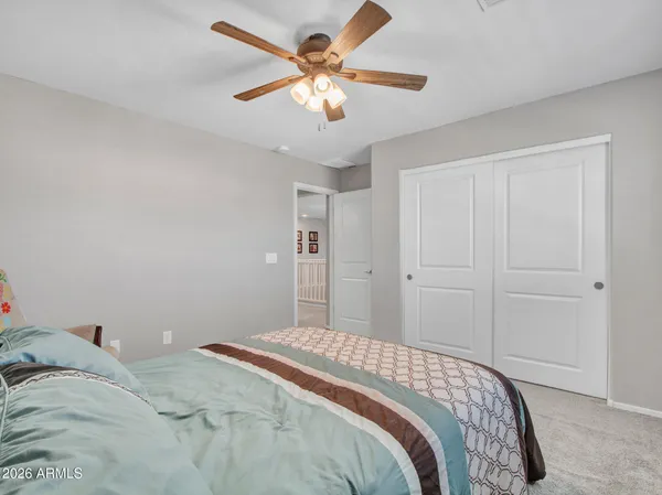 a front view of a house with garden and patio