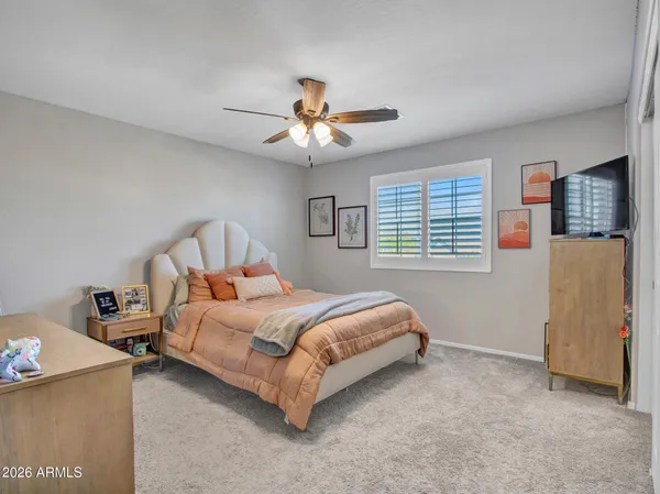 an aerial view of a house with a mountain