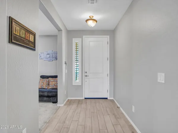 a kitchen with granite countertop white cabinets stainless steel appliances and sink
