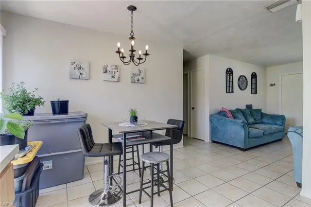 a kitchen with a sink a stove cabinets and a window