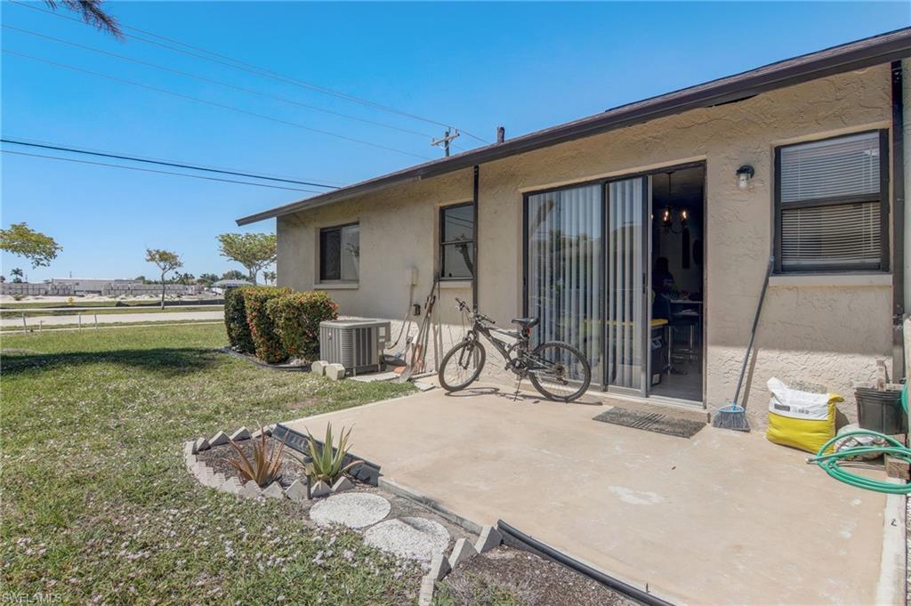 4209 Skyline Boulevard, Unit 4209 Cape Coral, FL 33914 - Photo 22 of 23 a view of a house with outdoor seating area