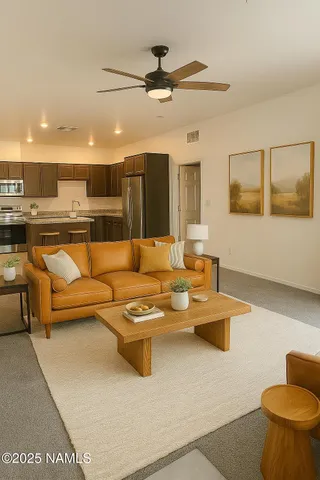 a living room with furniture and a chandelier