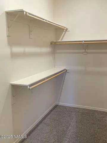 a bathroom with a granite countertop sink a toilet and a mirror