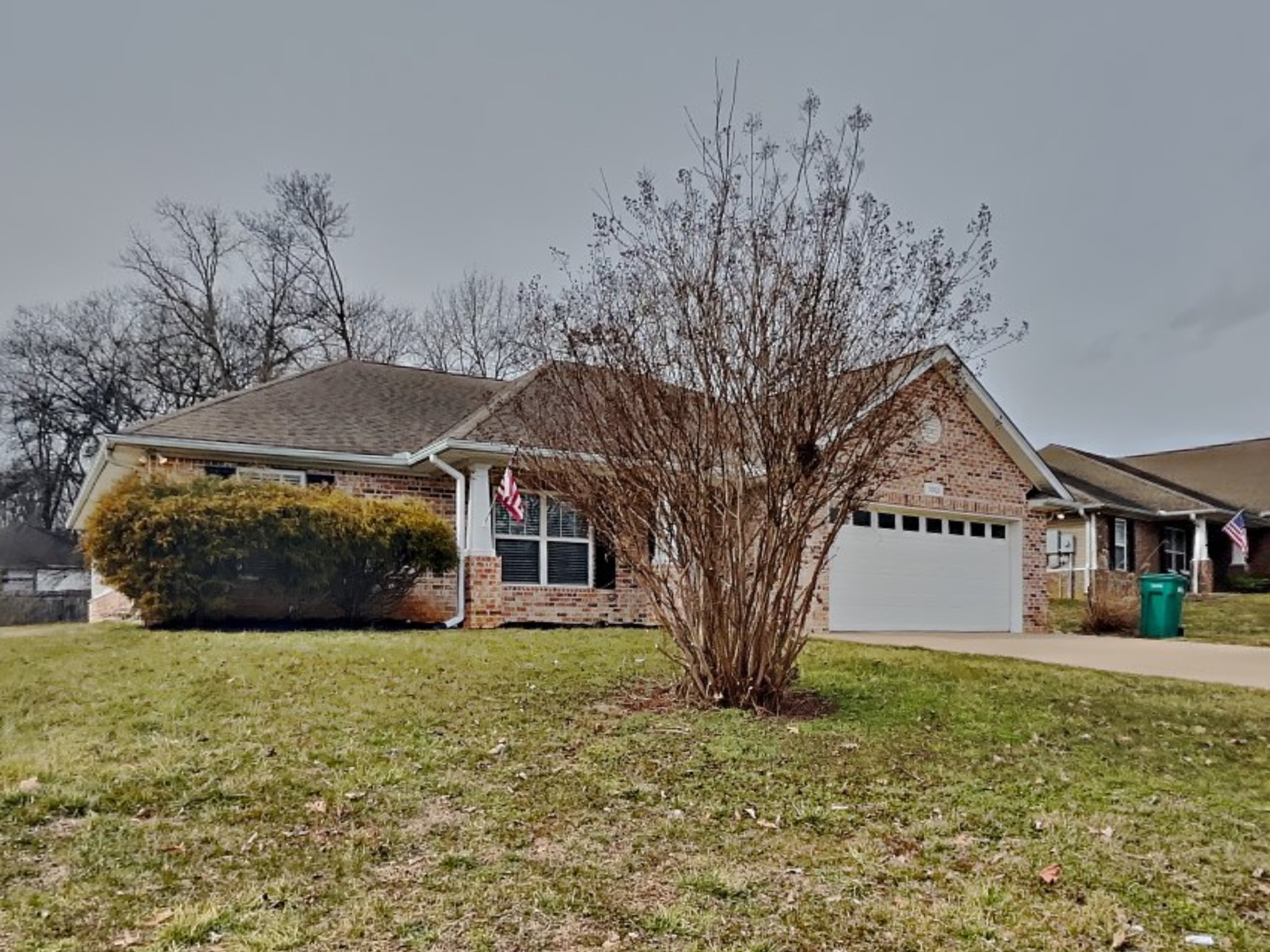 5003 Morning Dove Lane Spring Hill, TN 37174 - Photo 1 of 15 a front view of a house with a yard and garage
