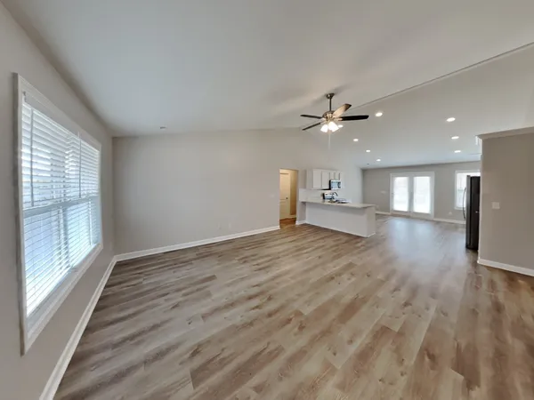 a view of an empty room with a window