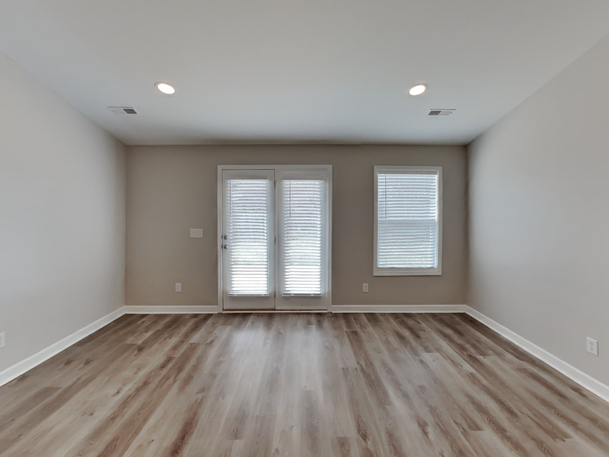5003 Morning Dove Lane Spring Hill, TN 37174 - Photo 4 of 15 an empty room with wooden floor and windows
