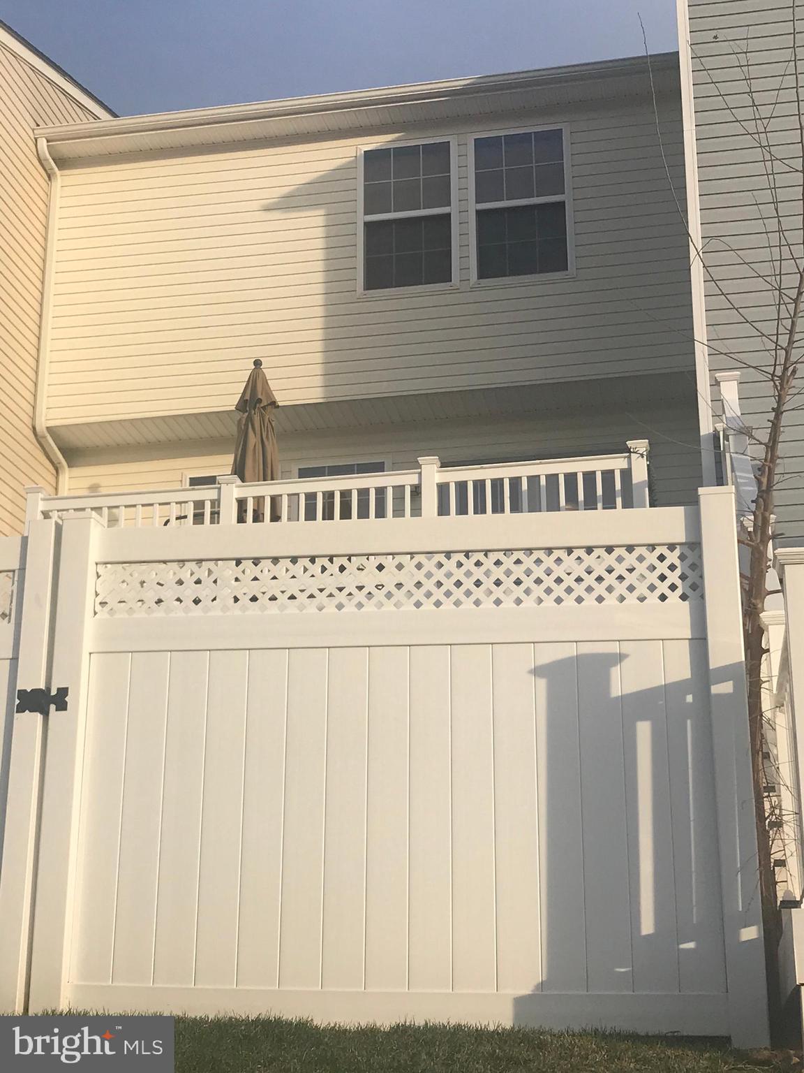 1137 Mare Street Ranson, WV 25438 - Photo 41 of 42 View of rear yard and white vinyl fencing