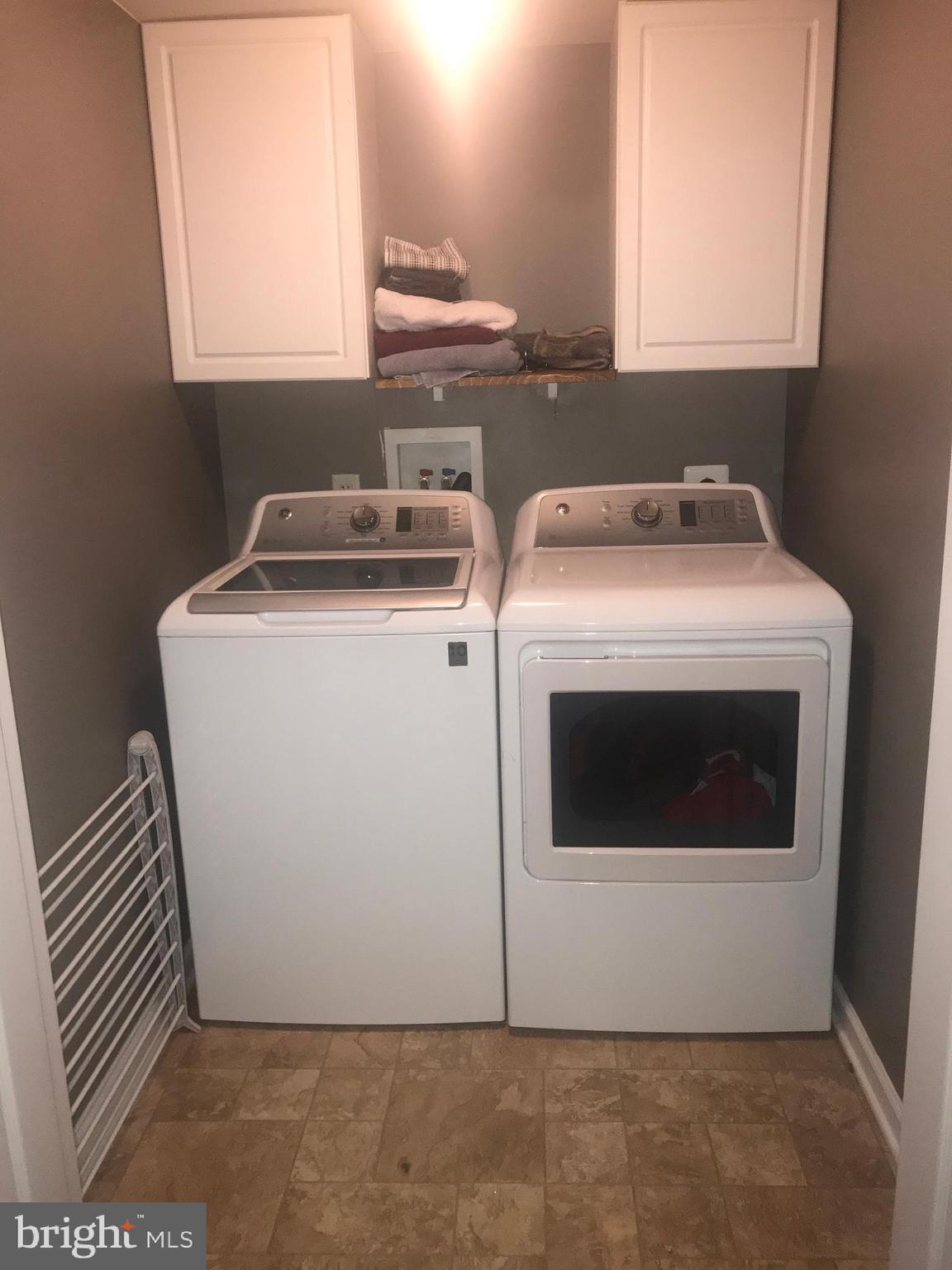 1137 Mare Street Ranson, WV 25438 - Photo 9 of 42 Walk in laundry closet with cabinets and shelving