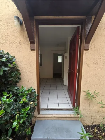 a view of a livingroom with wooden floor and a window