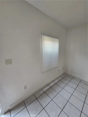 a view of empty room with windows