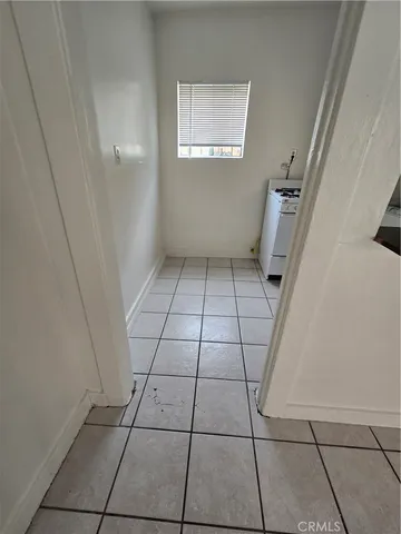 a kitchen with cabinets and appliances