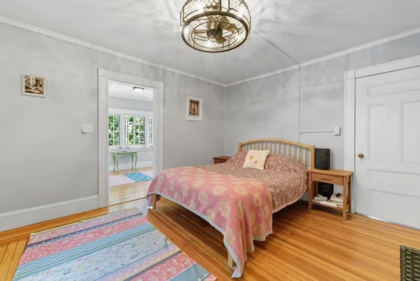 a bedroom with bed and window