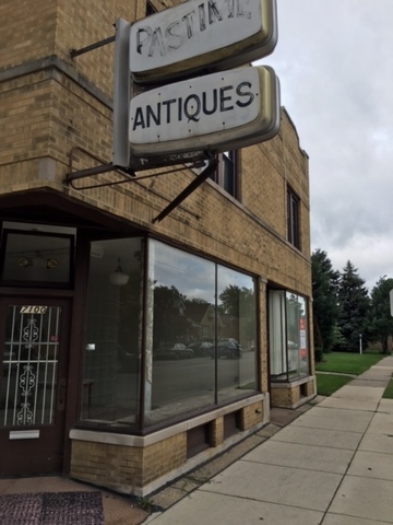 a street sign on a brick wall