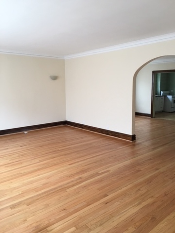 7100 16th Street Berwyn, IL 60402 - Photo 2 of 6 a view of an empty room with wooden floor
