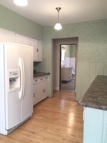 7100 16th Street Berwyn, IL 60402 - Photo 3 of 6 a kitchen with stainless steel appliances granite countertop a refrigerator a sink and a stove