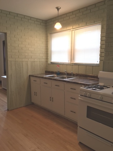 7100 16th Street Berwyn, IL 60402 - Photo 4 of 6 a kitchen with a stove a sink and a window