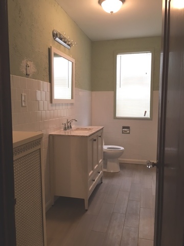 7100 16th Street Berwyn, IL 60402 - Photo 6 of 6 a bathroom with a sink toilet and mirror