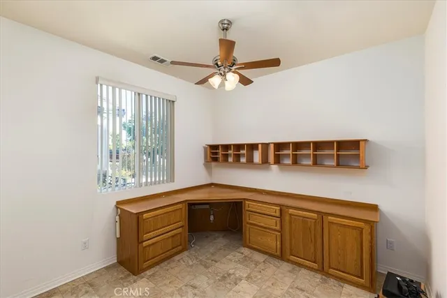 a kitchen with a refrigerator a sink and cabinets
