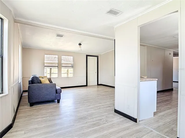 a living room with furniture and window