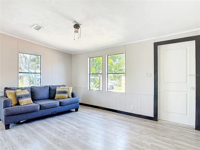 a living room with furniture and a window
