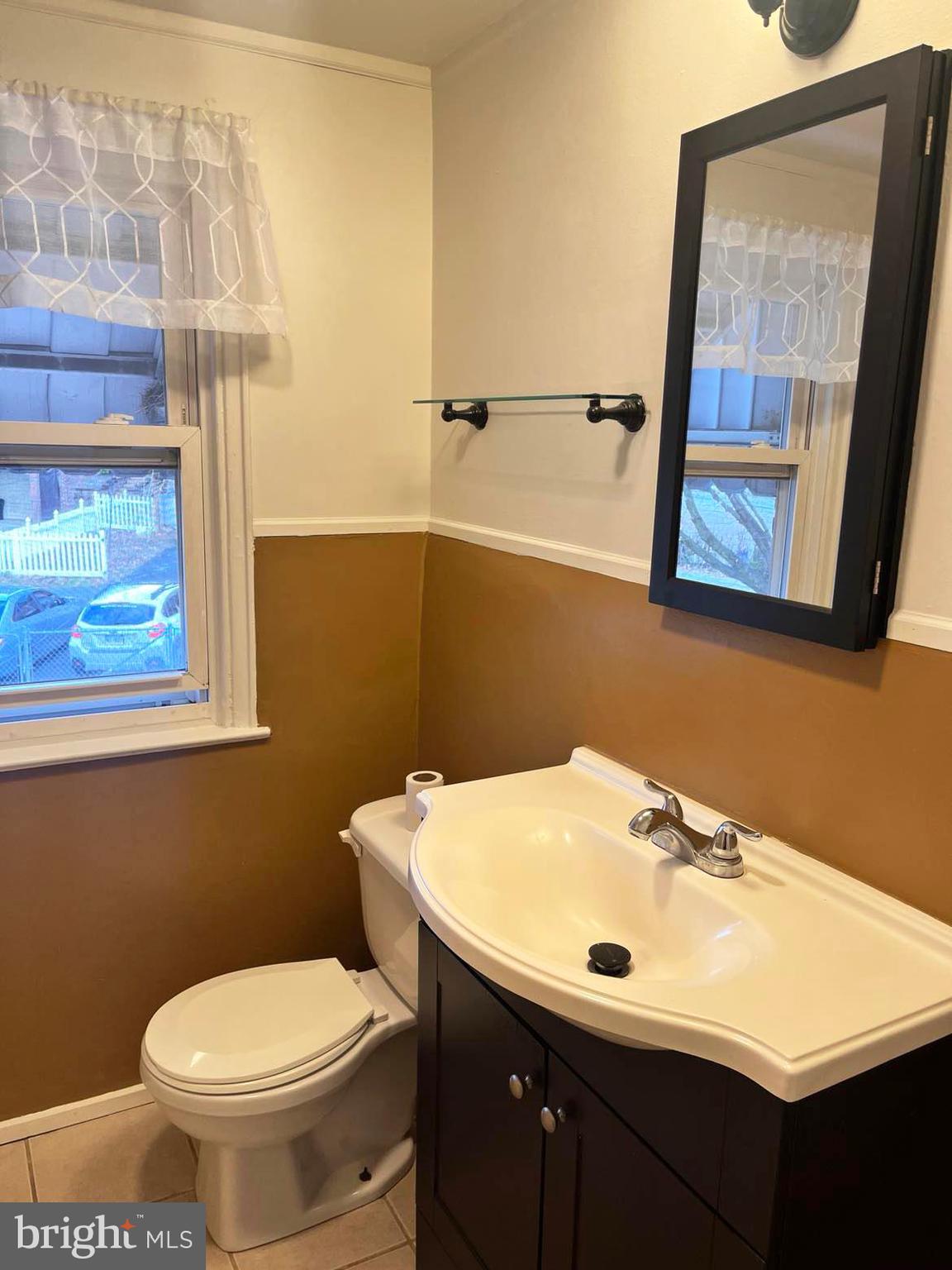 210 Sycamore Road Reading, PA 19611 - Photo 11 of 16 a bathroom with a sink toilet and mirror