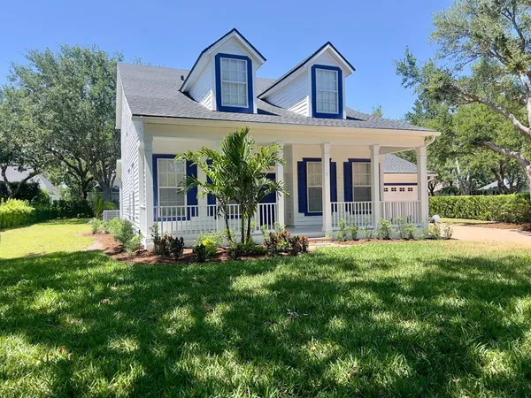 front view of a house with a small yard