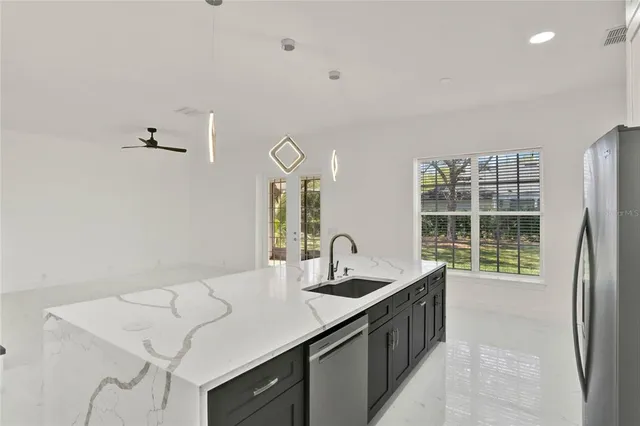 a kitchen with a sink and a stove