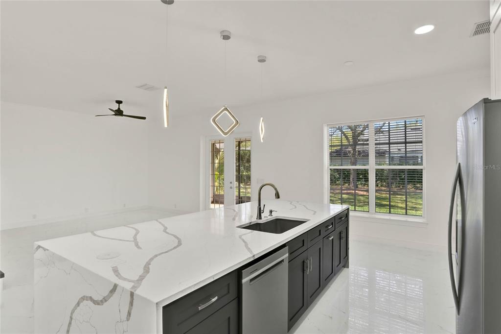 8418 Bowden Way Windermere, FL 34786 - Photo 11 of 31 a kitchen with a sink and a stove