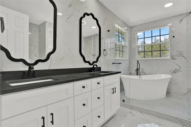 a bathroom with sinks double vanity and a mirror