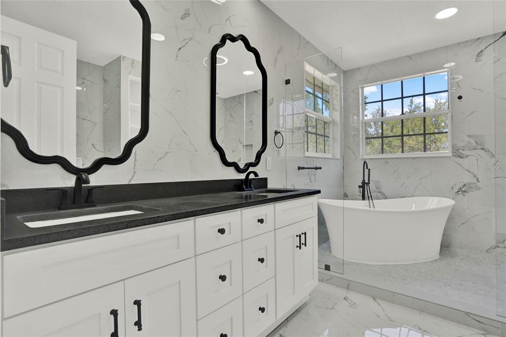 8418 Bowden Way Windermere, FL 34786 - Photo 21 of 31 a bathroom with sinks double vanity and a mirror