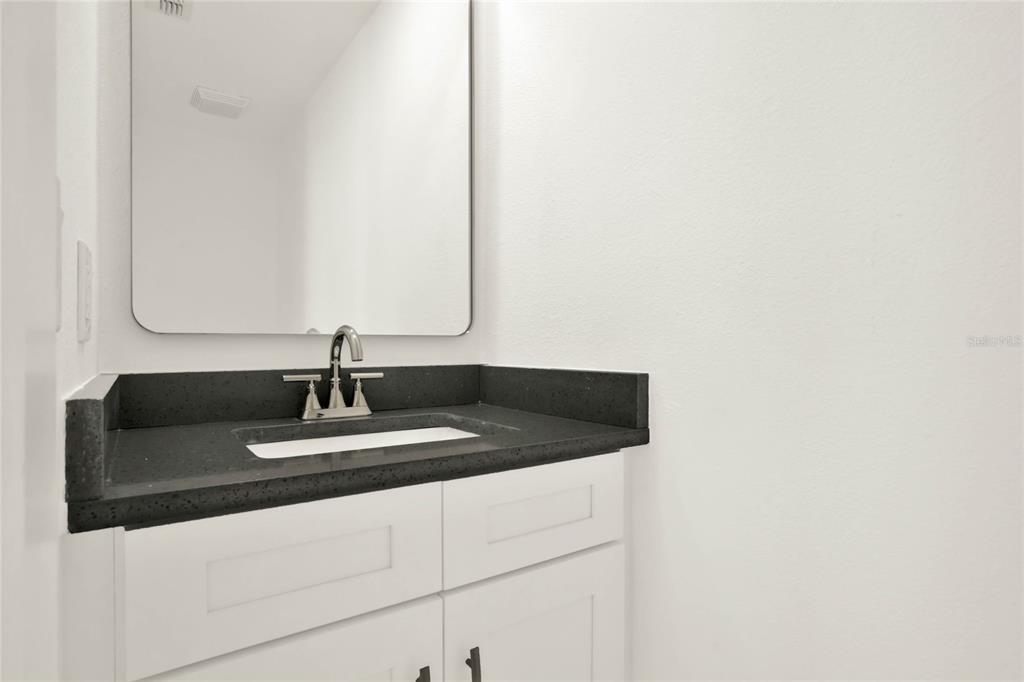 8418 Bowden Way Windermere, FL 34786 - Photo 23 of 31 a bathroom with a sink and a mirror