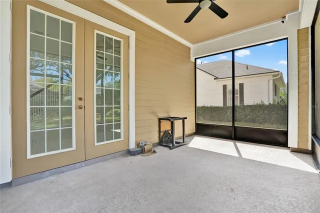 a view of an empty room with windows