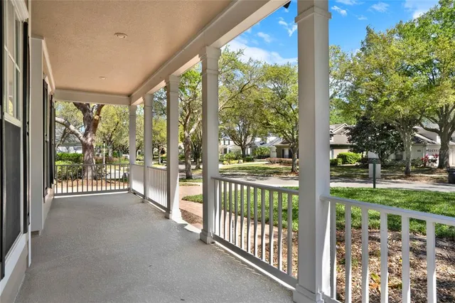 a view of a porch with wooden fence
