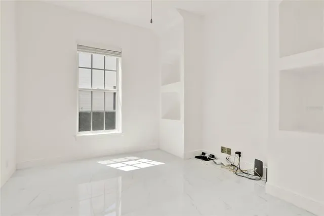 an empty room with windows