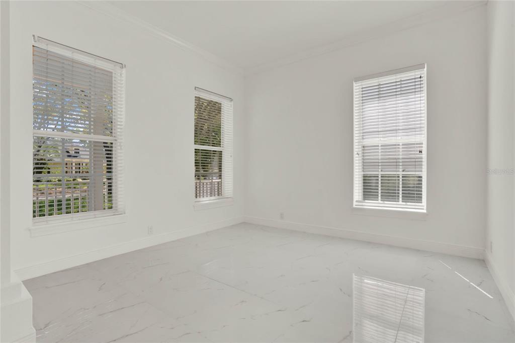 8418 Bowden Way Windermere, FL 34786 - Photo 10 of 31 a view of an empty room with a window