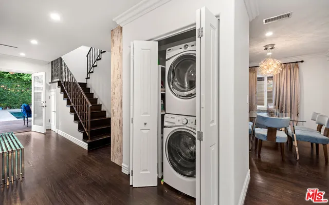 a view of a hallway with washer and dryer