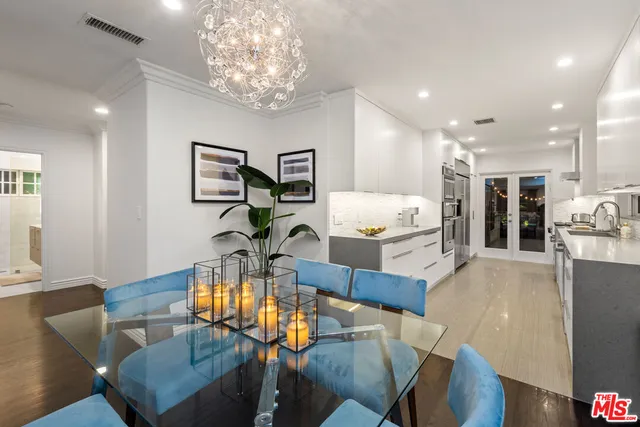 a living room with dining table furniture and kitchen view