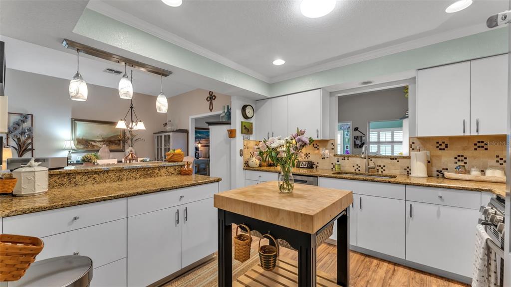 728 Canberra Road Winter Haven, FL 33884 - Photo 14 of 47 a kitchen with sink and cabinets