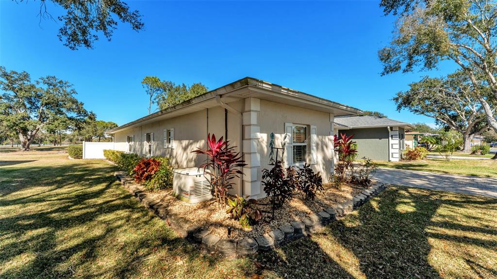 728 Canberra Road Winter Haven, FL 33884 - Photo 2 of 47 a front view of a house with a yard
