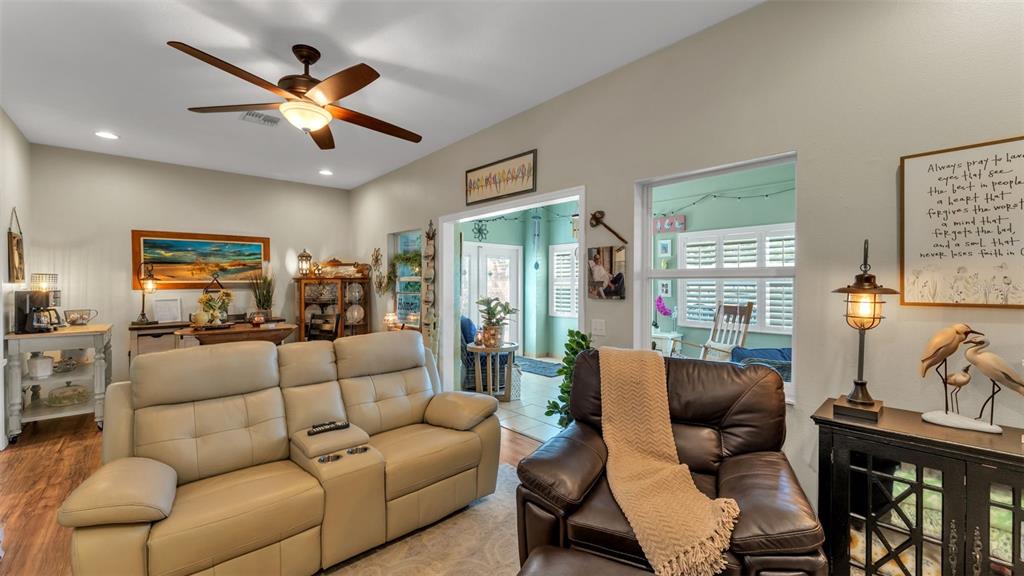 728 Canberra Road Winter Haven, FL 33884 - Photo 21 of 47 a living room with furniture and a large window