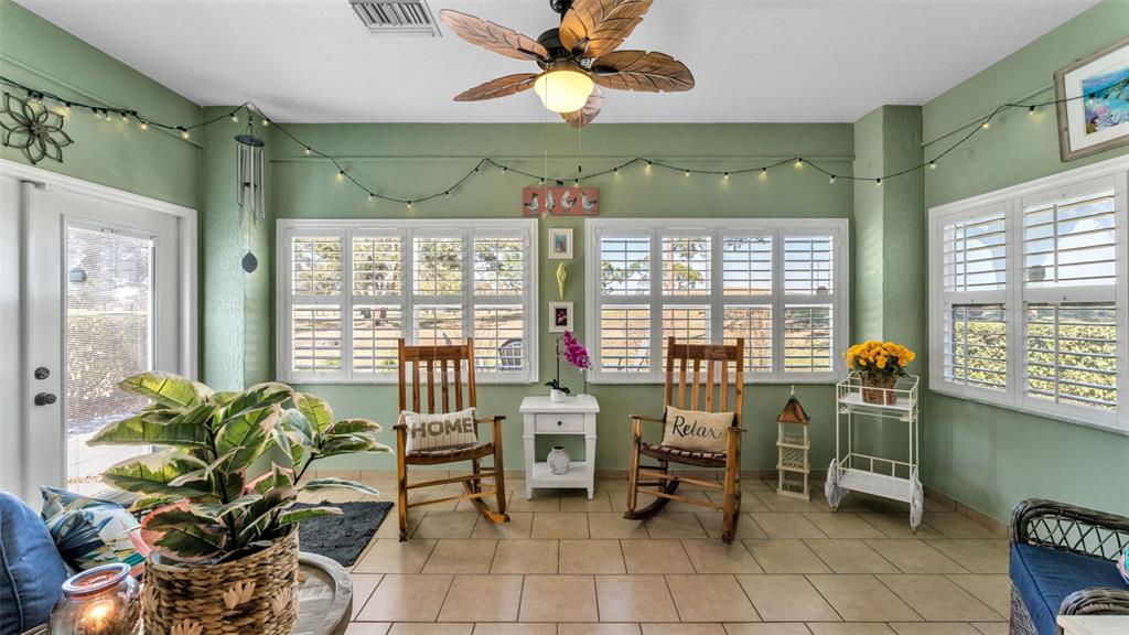 728 Canberra Road Winter Haven, FL 33884 - Photo 23 of 47 a dining room with furniture and a chandelier