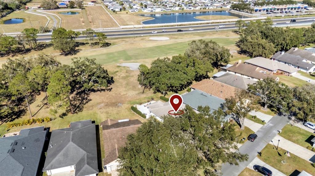 728 Canberra Road Winter Haven, FL 33884 - Photo 4 of 47 an aerial view of residential houses with outdoor space