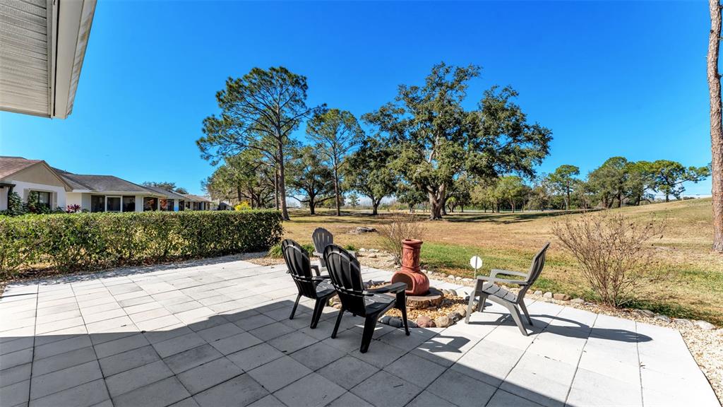 728 Canberra Road Winter Haven, FL 33884 - Photo 43 of 47 a view of a chairs and table in patio