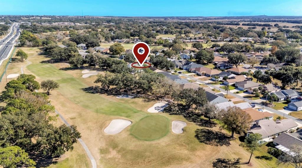 728 Canberra Road Winter Haven, FL 33884 - Photo 44 of 47 a view of a street with a building in the background