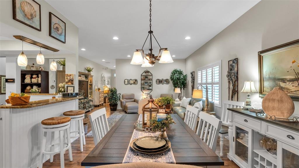 728 Canberra Road Winter Haven, FL 33884 - Photo 10 of 47 a very nice looking dining room with a large dining table and chairs