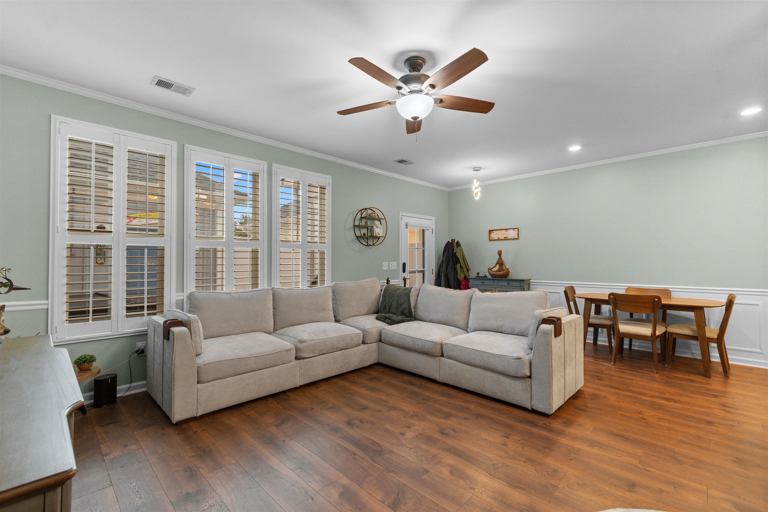 2408 Heritage Loop, Unit 2408 Myrtle Beach, SC 29577 - Photo 9 of 40 Living area featuring ornamental molding, a ceiling fan, and hardwood / wood-style floors