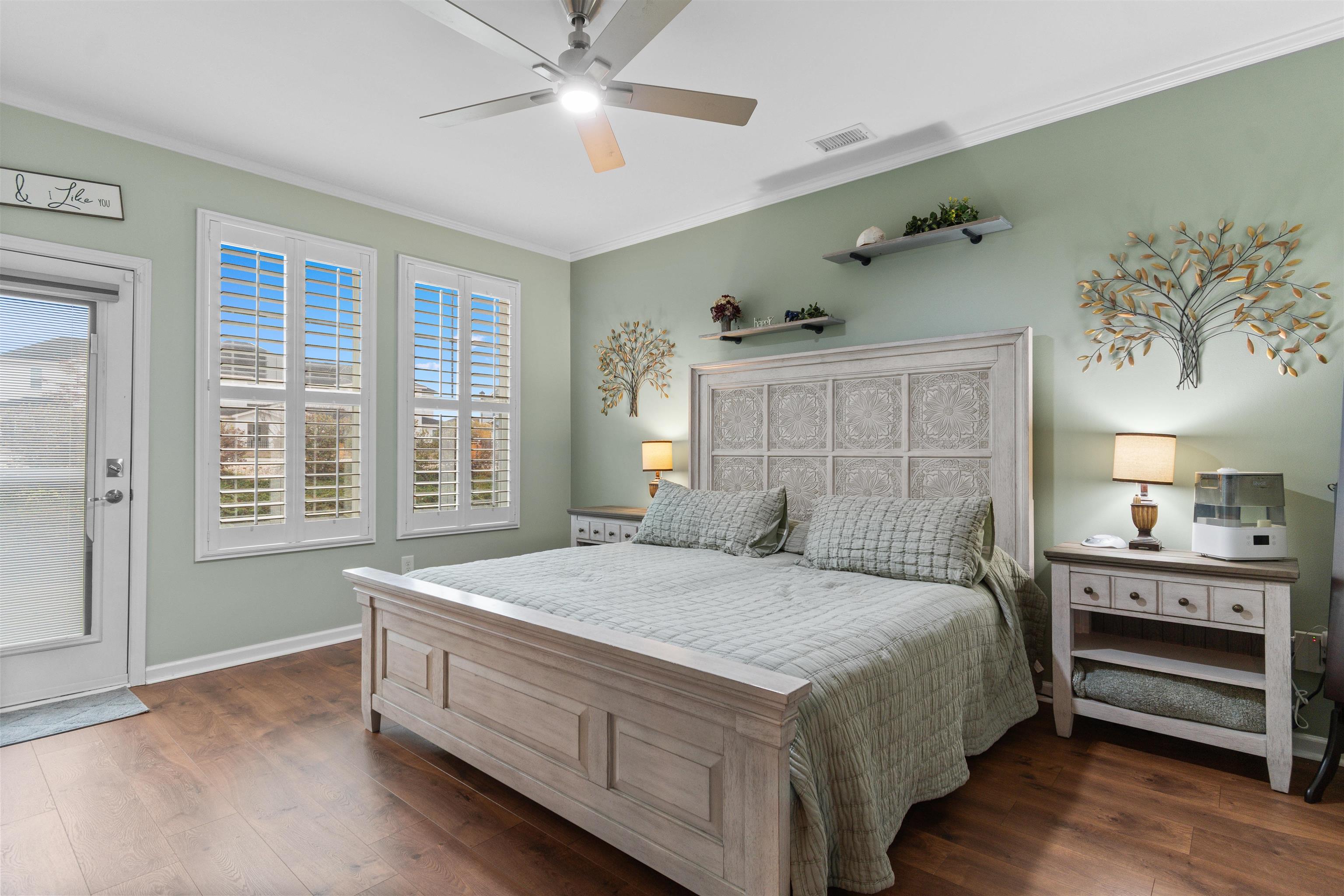 2408 Heritage Loop, Unit 2408 Myrtle Beach, SC 29577 - Photo 11 of 40 Bedroom featuring access to exterior, ornamental molding, dark wood-style flooring, and a ceiling fan